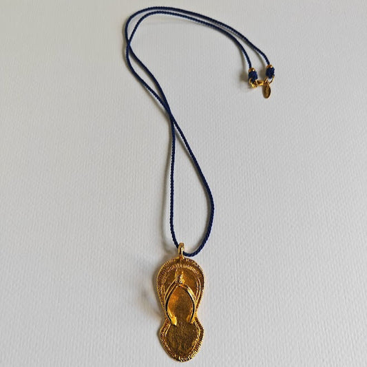 Royal Slipper Pendant in lost-wax brass on piquant-green cotton cord, 41 cm

