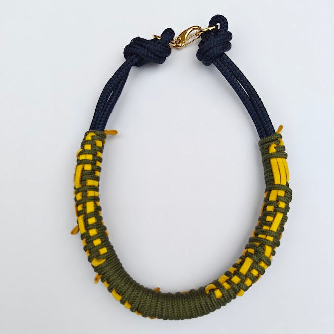 Khaki green and navy rope with yellow leather necklace on white background